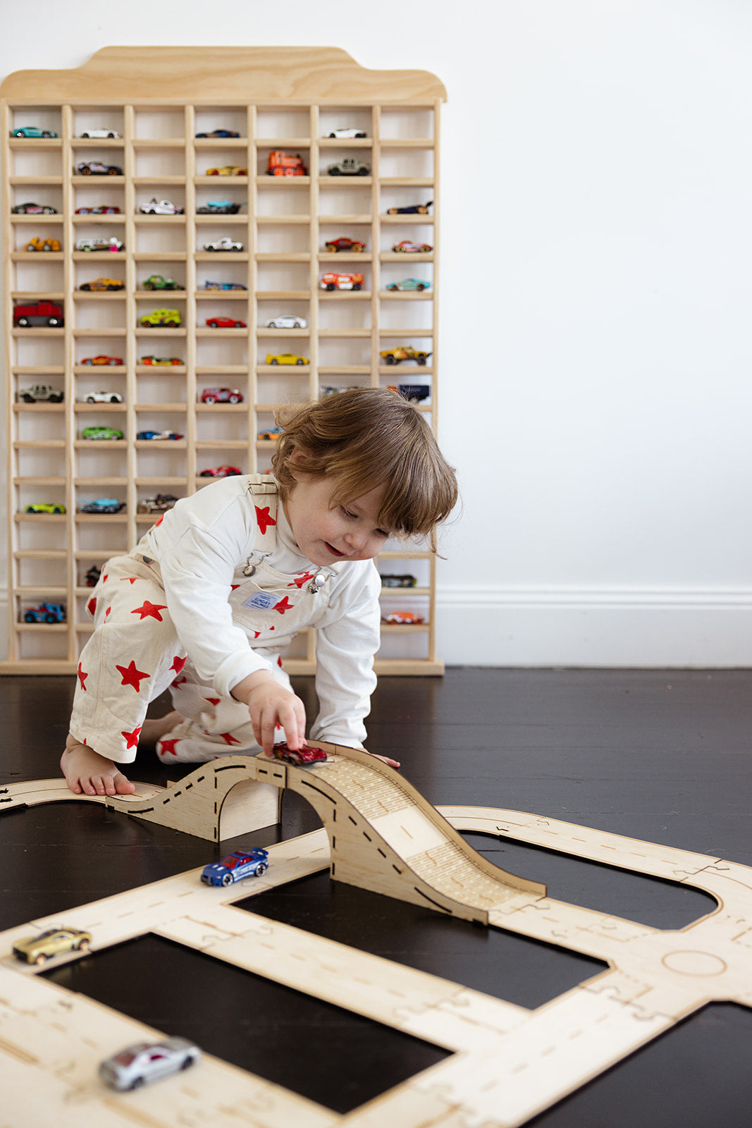 matchbox car storage and kid playing with car