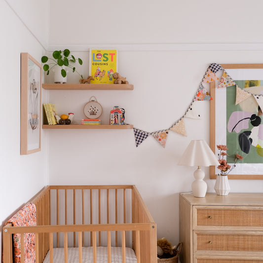Nursery shelf styling tips with our curved floating shelves